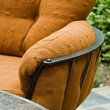 built-to-last72-555 An orange upholstered chair with a metal frame.