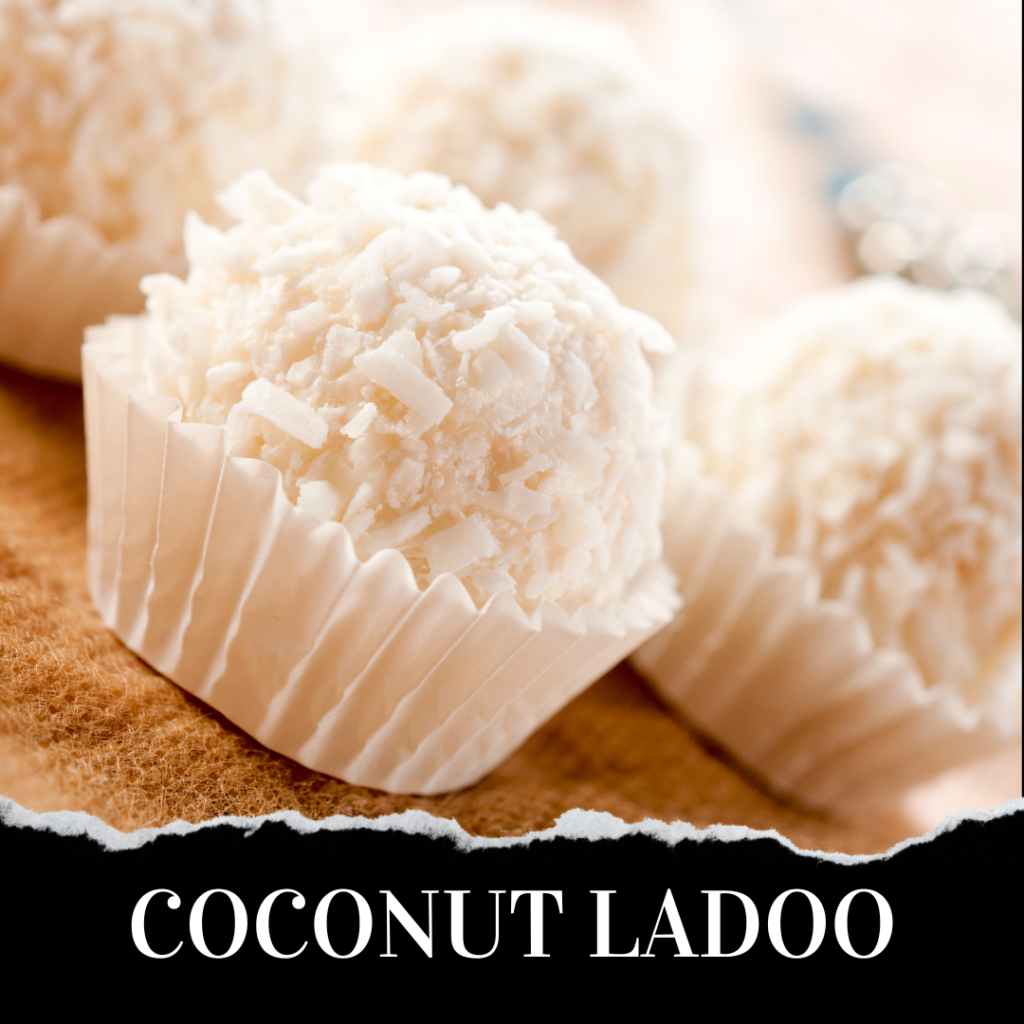 Close-up image of coconut ladoos in white paper cups with the text "COCONUT LADOO" at the bottom. The ladoos have a shredded coconut coating and are arranged neatly on a paper surface.