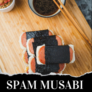 Spam musubi pieces stacked on a plate with a bowl of soy sauce and chopsticks nearby.